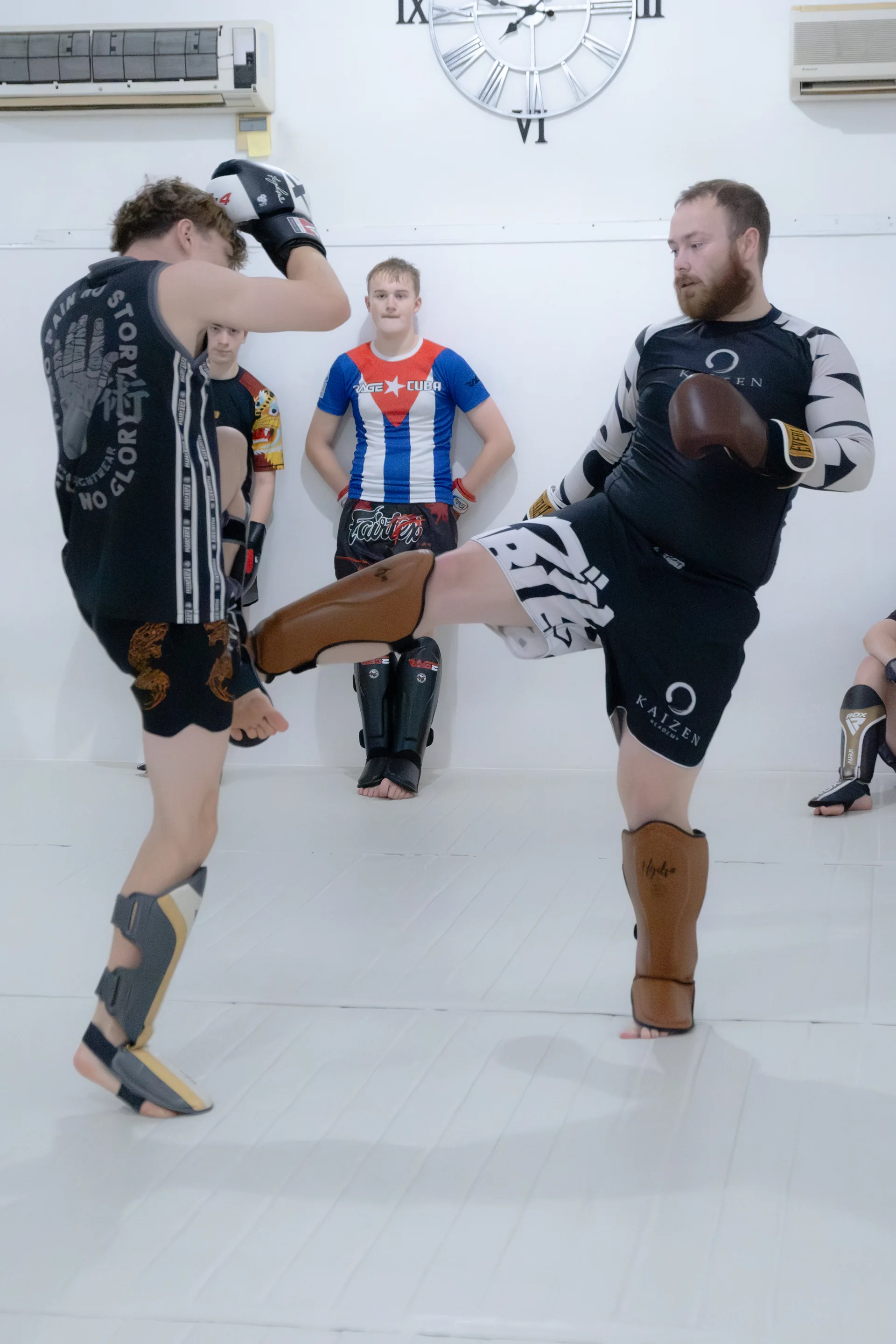 Kenny Murphy demonstrating a kick during a Kaizen kickboxing class
