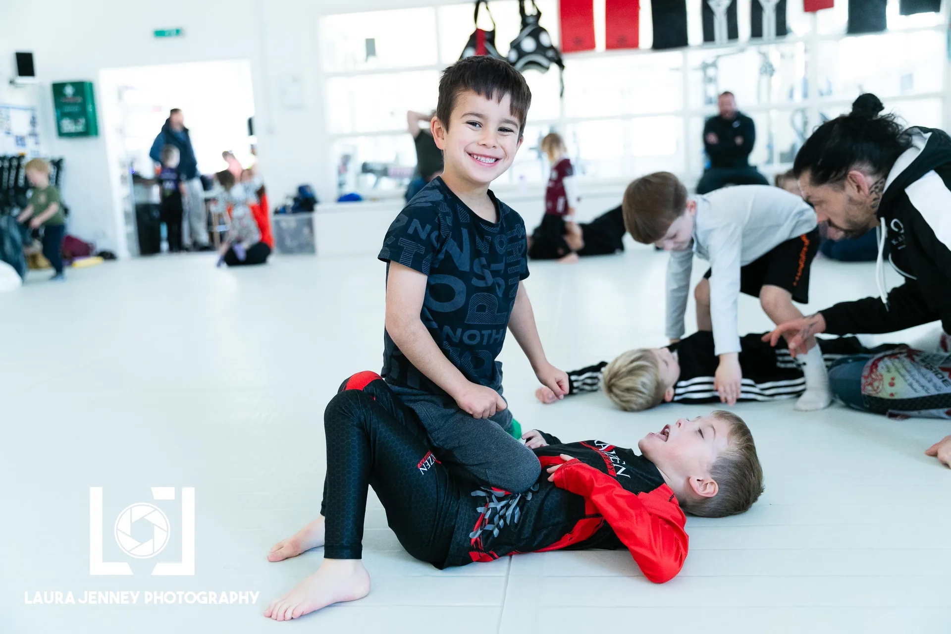 Children practising Brazilian Jiu-Jitsu together at Kaizen